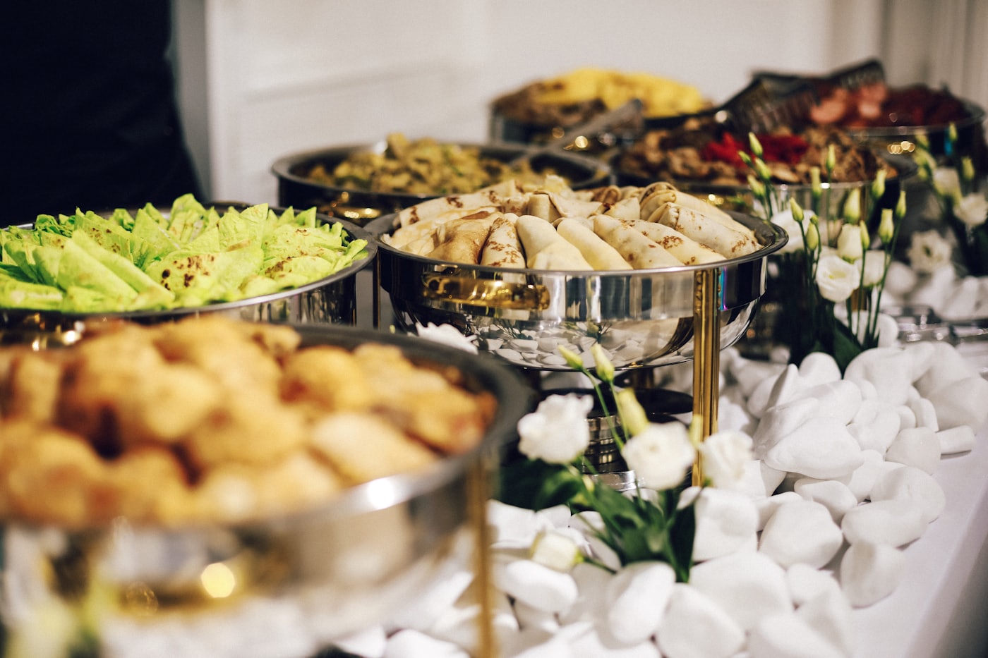 A catering buffet line with warm dishes