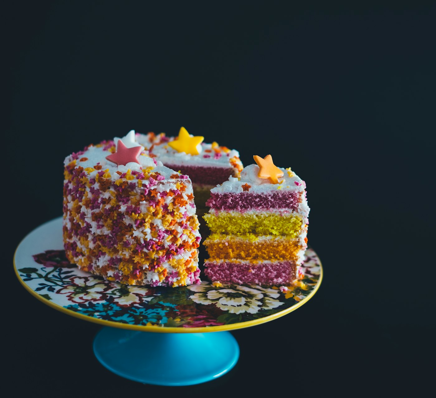 A rainbow layer cake slice