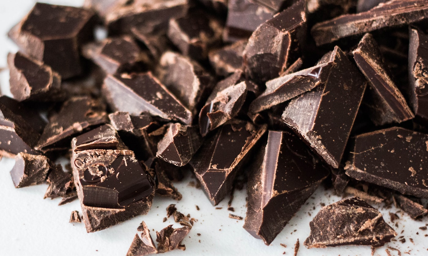 Rich 70% single-origin dark chocolate pieces arranged for a fondue, ready to melt