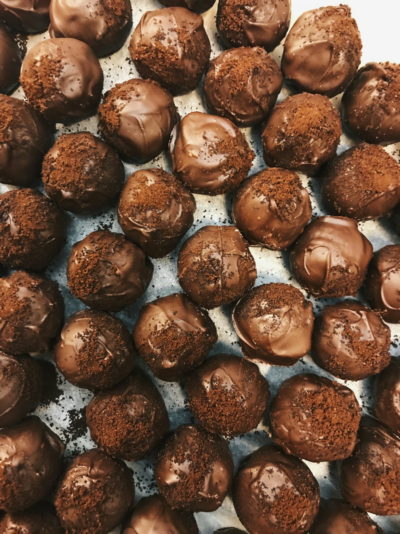 Dark chocolate sea-salt truffles arranged in a tray