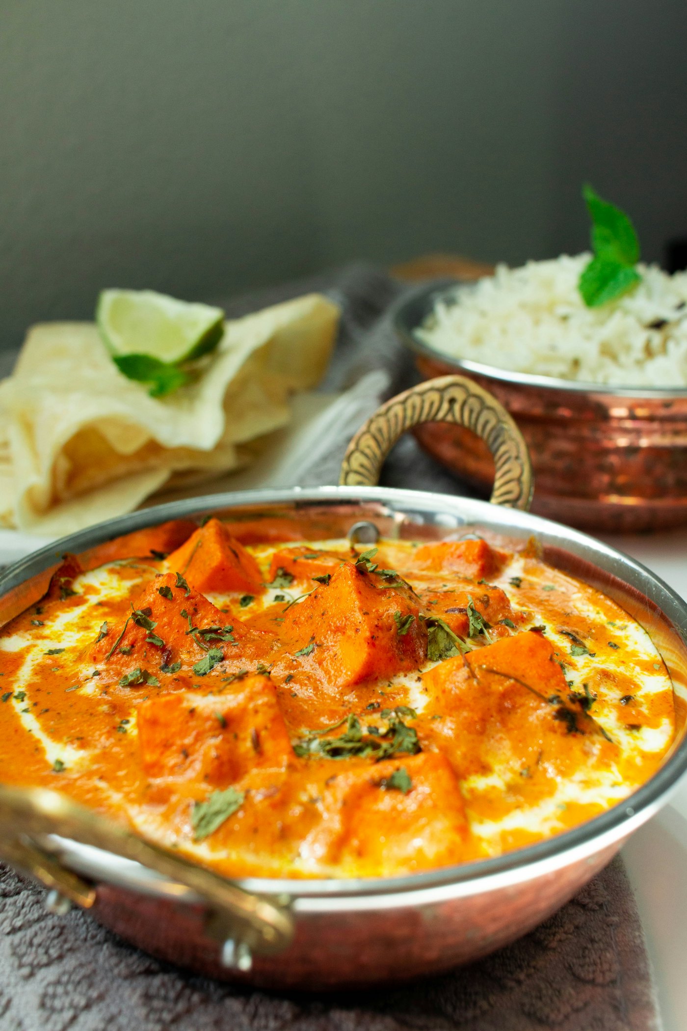 A rich catering curry served with warm naan