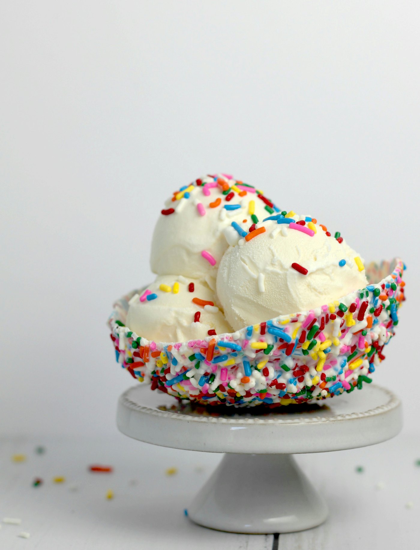 A tub of ice cream with sprinkles
