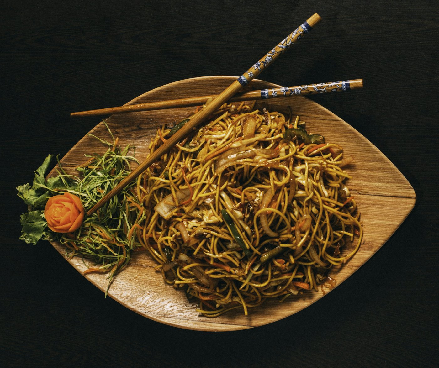 A bowl of stir-fried Chinese noodles with vegetables